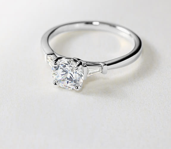 Blue Nile diamond engagement rings on a white background.